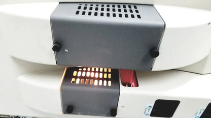White and gray thermo nicolet continuum infrared microscope with perforated vent panel black knobs and illuminated display