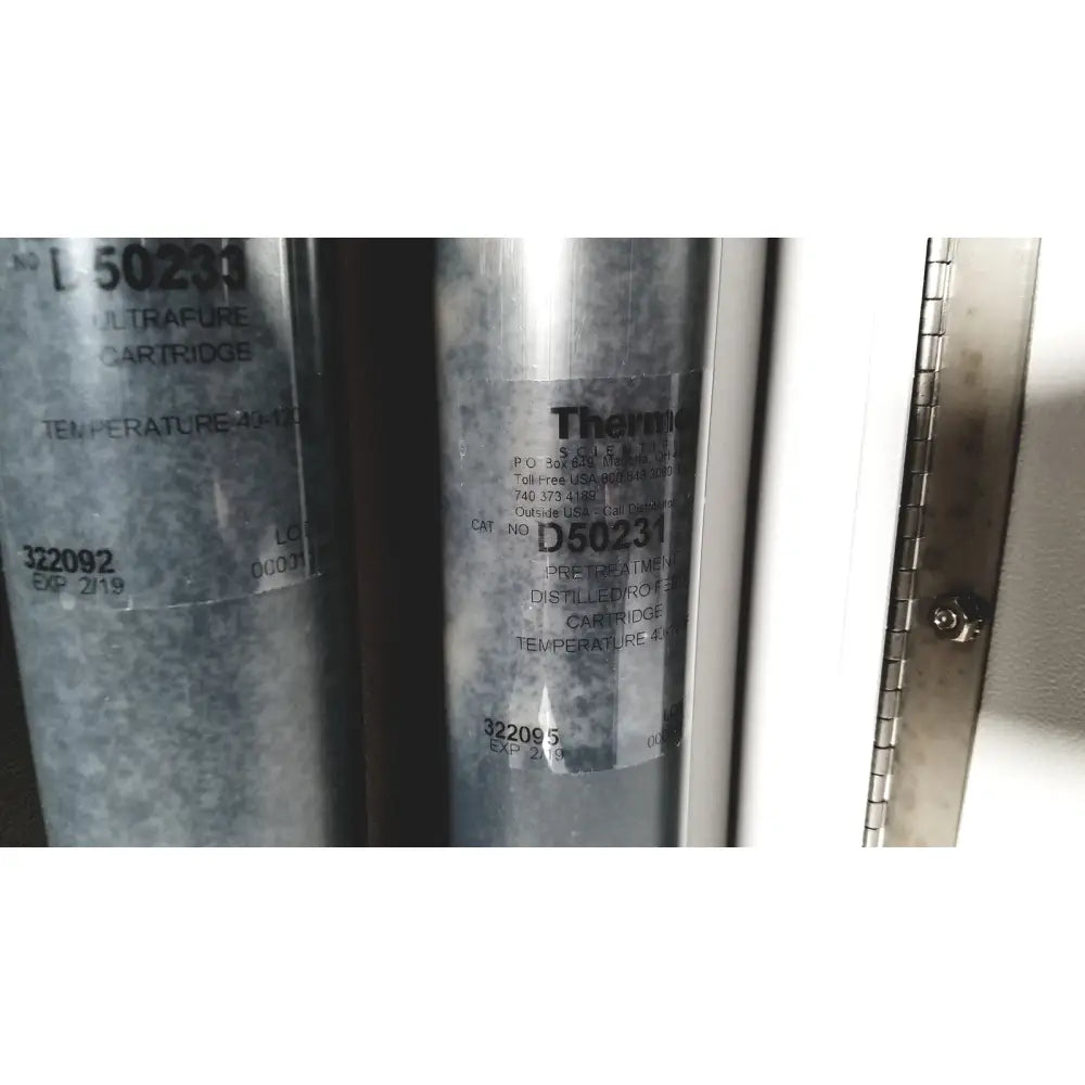 Silver cylindrical thermo scientific easypure ii d7401 d7401 lab grade water filter cartridge with black therma label