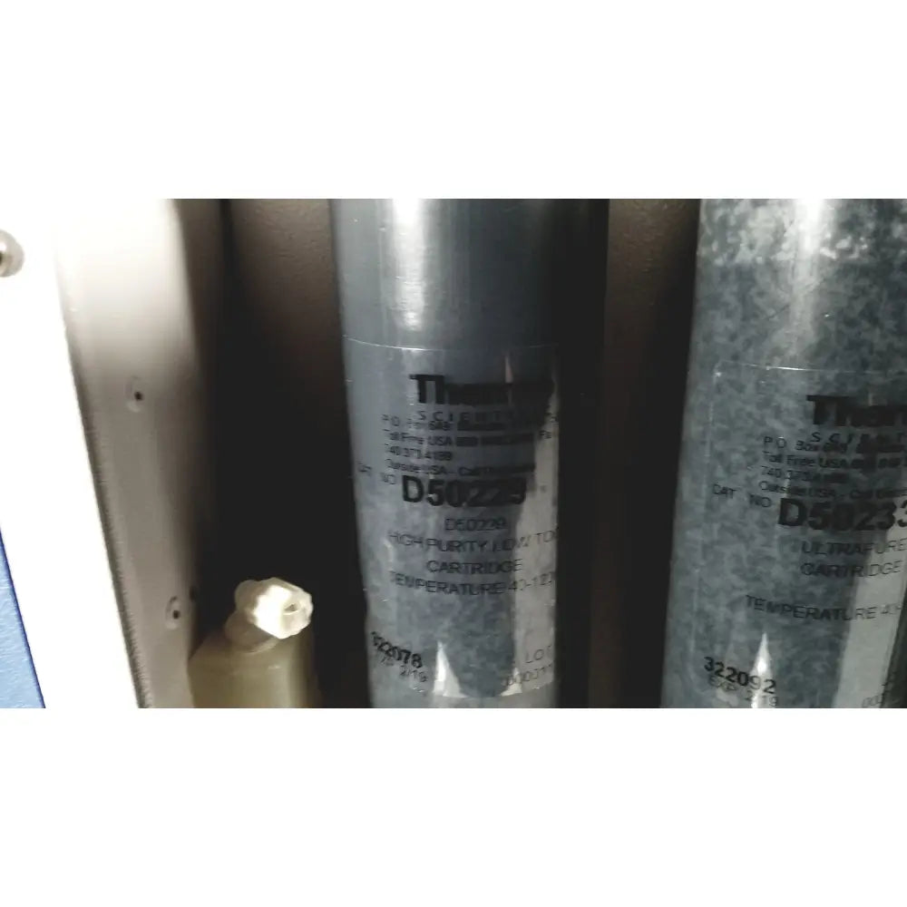 Gray cylindrical Thermo Scientific D5029 high-purity low temperature cartridge for Easypure II D7401 lab grade filter system