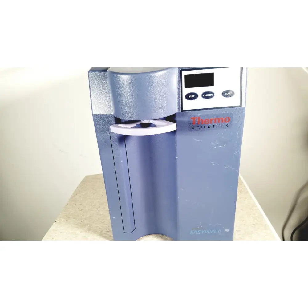 Blue-gray thermo scientific easypure ii d7401 lab grade water filter system with digital control panel and white accents