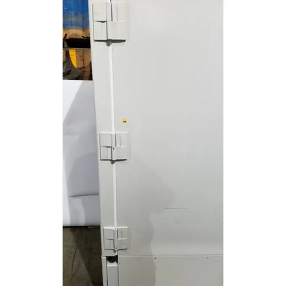 White industrial door with three vertical rectangular latches on thermo scientific forma 88000 ultra-low temperature freezer