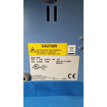 Blue thermo scientific gas guard model 3050 industrial electronic equipment with yellow caution label and white specification tag