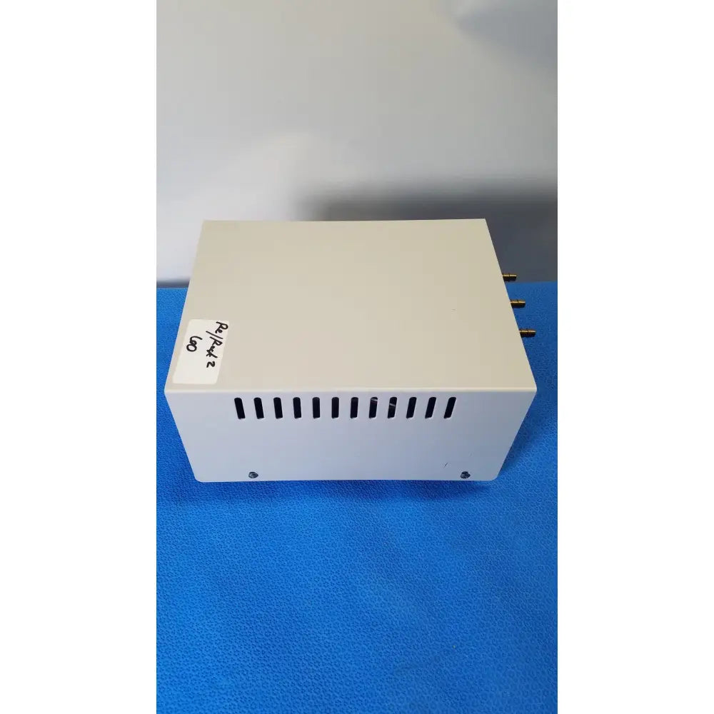 Off-white rectangular thermo scientific gas guard model 3050 with ventilation slits and gold connectors on the side