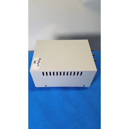 Off-white rectangular thermo scientific gas guard model 3050 with ventilation slits and gold connectors on the side