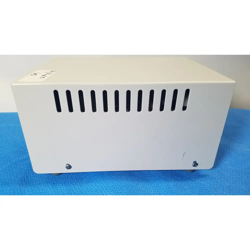 White rectangular thermo scientific gas guard model 3050 with vertical ventilation slots and screws on the back side