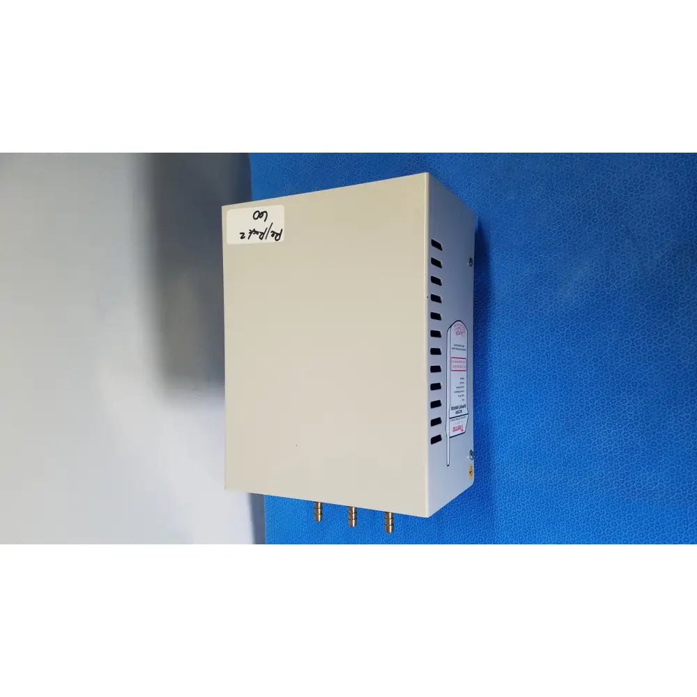 Beige rectangular thermo scientific gas guard model 3050 with vertical ventilation slits and brass connectors shown from back side