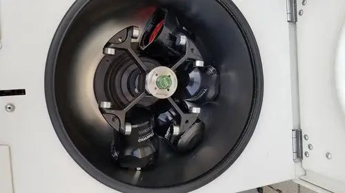 Black rotor with red and green accents inside the thermo scientific heraeus megafuge 16 centrifuge chamber