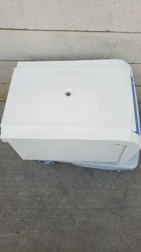 Thermo scientific heraeus megafuge 16 centrifuge is a white plastic medical centrifuge with blue accents and circular top opening