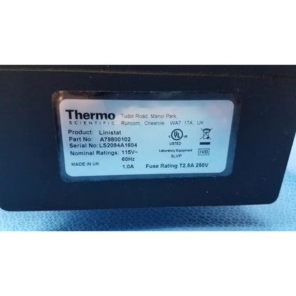 Black thermo scientific linistat linear slide stainer with white label showing product details and certification marks