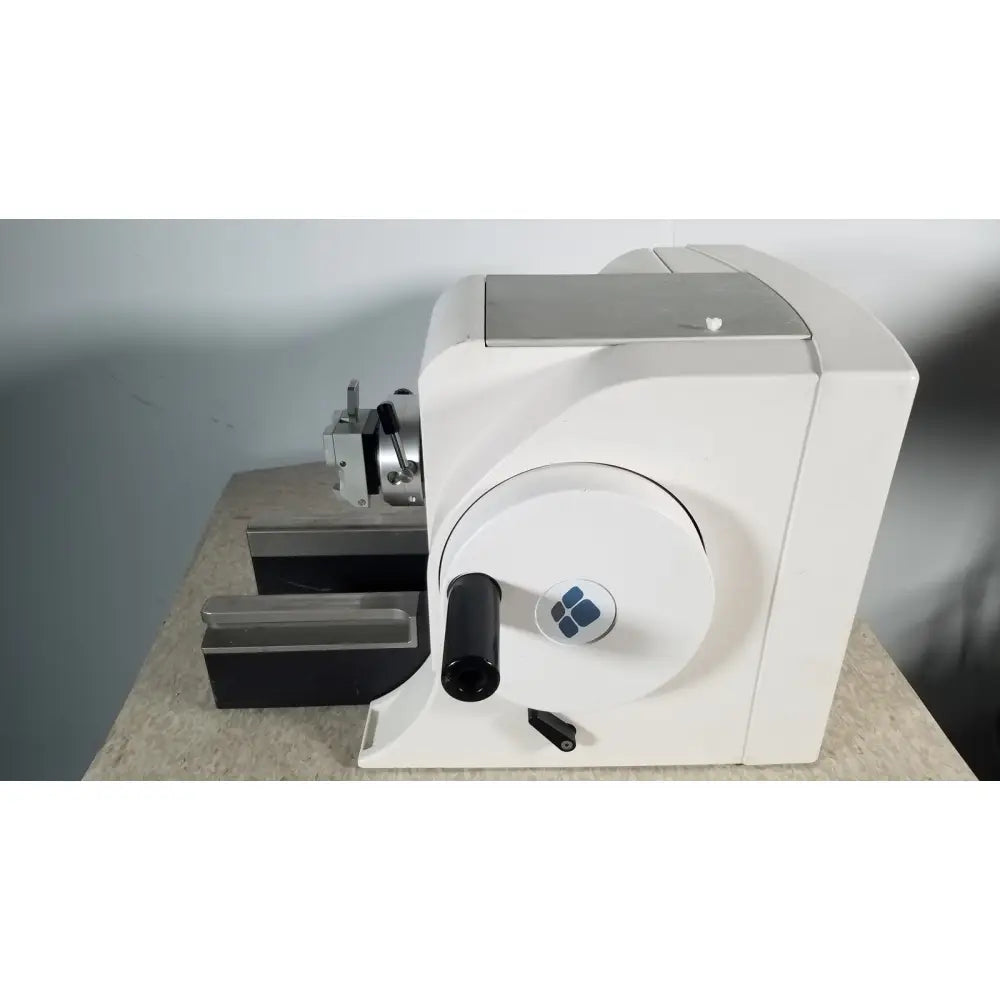 White industrial material testing machine thermo scientific microm hm 340e with circular dial black handle and blue logo serial 45258