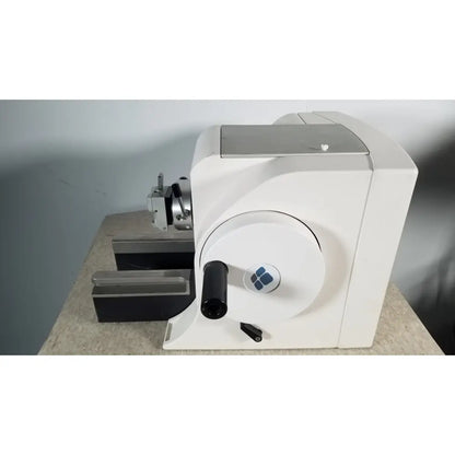 White industrial material testing machine thermo scientific microm hm 340e with circular dial black handle and blue logo serial 45258