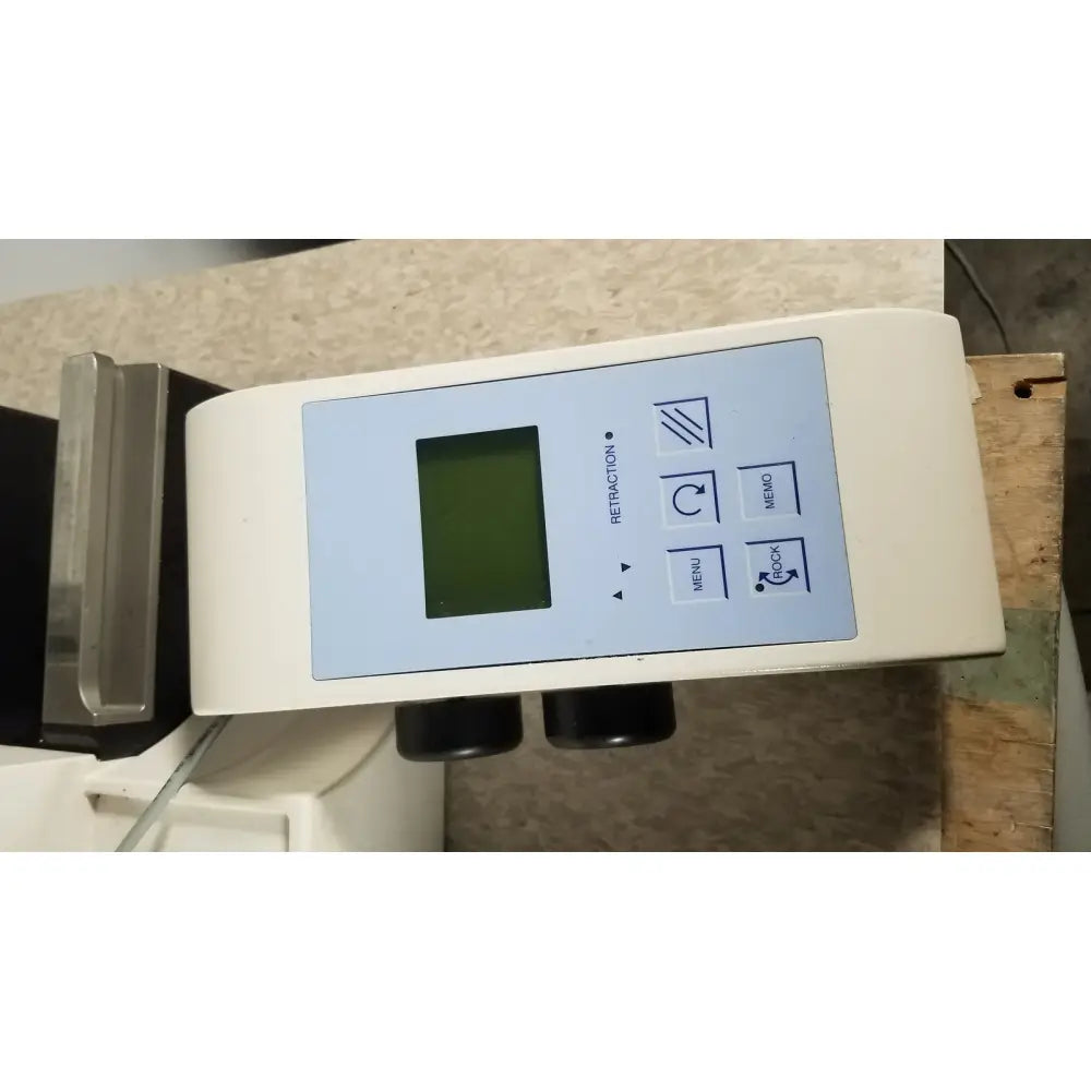 White rectangular thermo scientific microm hm 340e digital device with green screen and labeled buttons for retraction menu memo rock