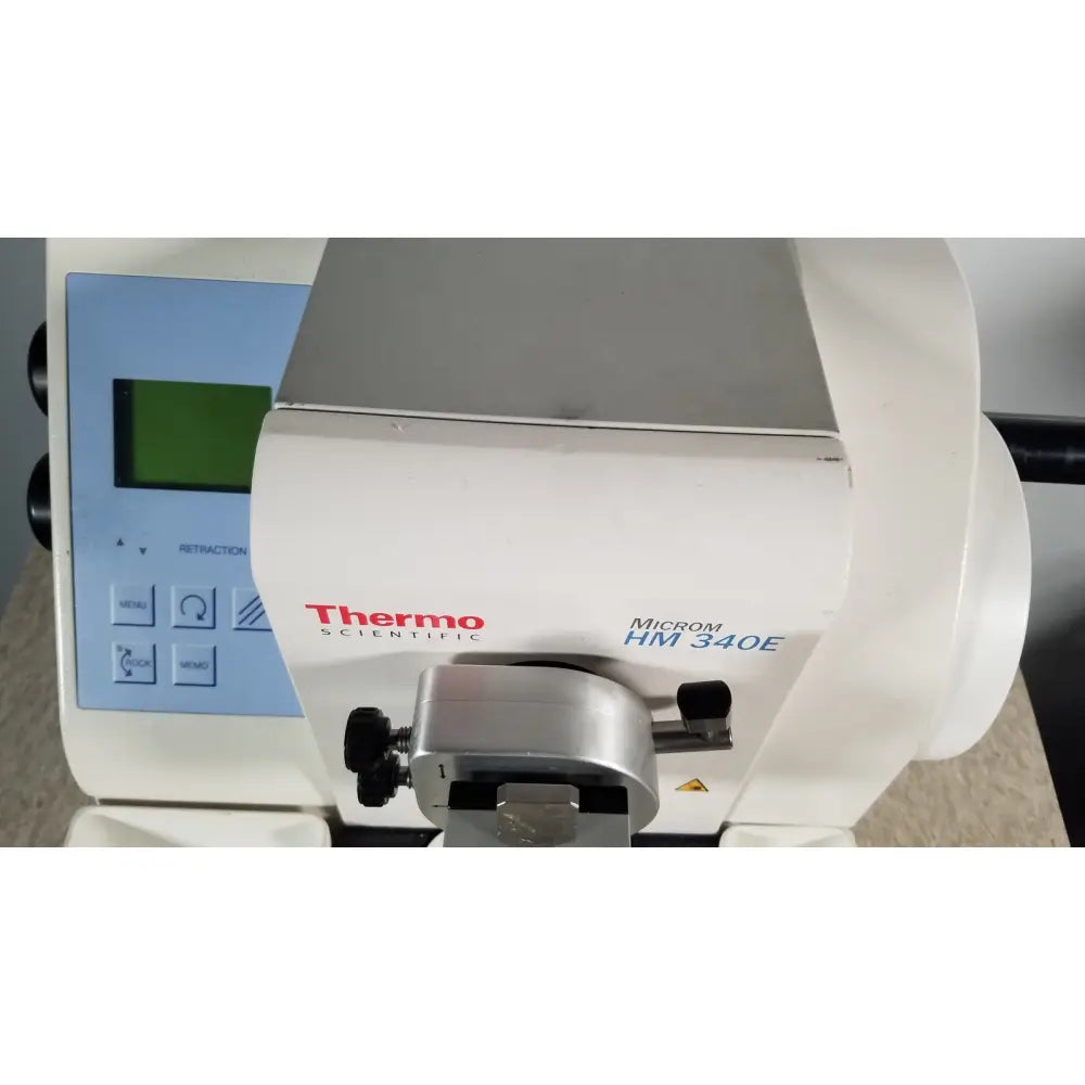 White thermo scientific microm hm 340e dental curing light with silver metallic clamp and black knobs serial no 45258