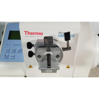 White thermo scientific microm hm 340e microfluidic pump with metallic silver clamp and black knobs serial no 45258