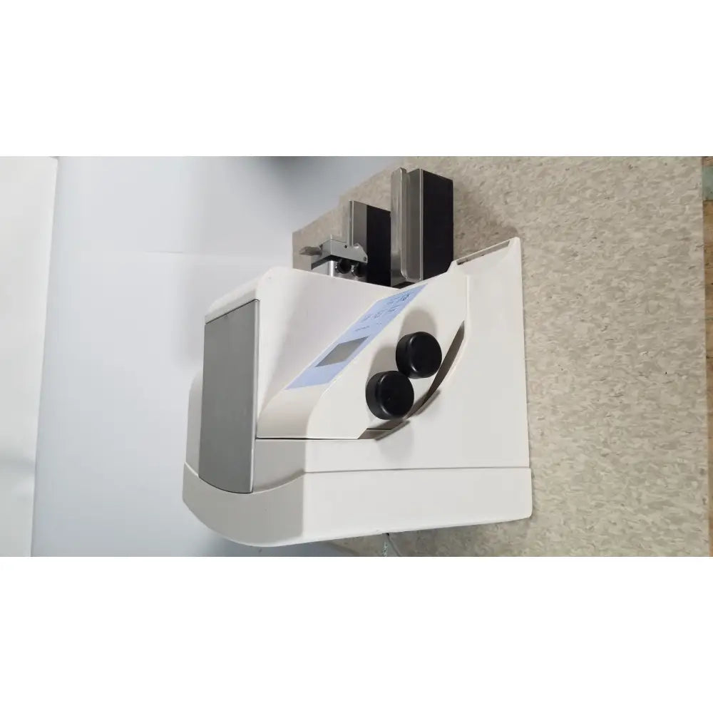 White and gray thermo scientific microm hm 340e medical device with two black circular dials on front panel serial no 45258