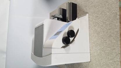 White and gray thermo scientific microm hm 340e medical device with two black circular dials on front panel serial no 45258