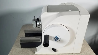 White industrial material testing machine thermo scientific microm hm 340e with circular dial black handle and blue logo serial 45258