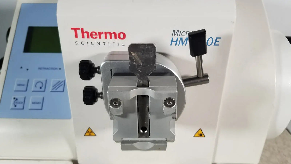 White thermo scientific microm hm 340e microfluidic pump with metallic silver clamp and black knobs serial no 45258