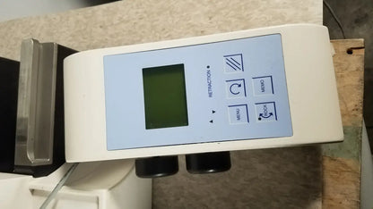 White rectangular thermo scientific microm hm 340e digital device with green screen and labeled buttons for retraction menu memo rock