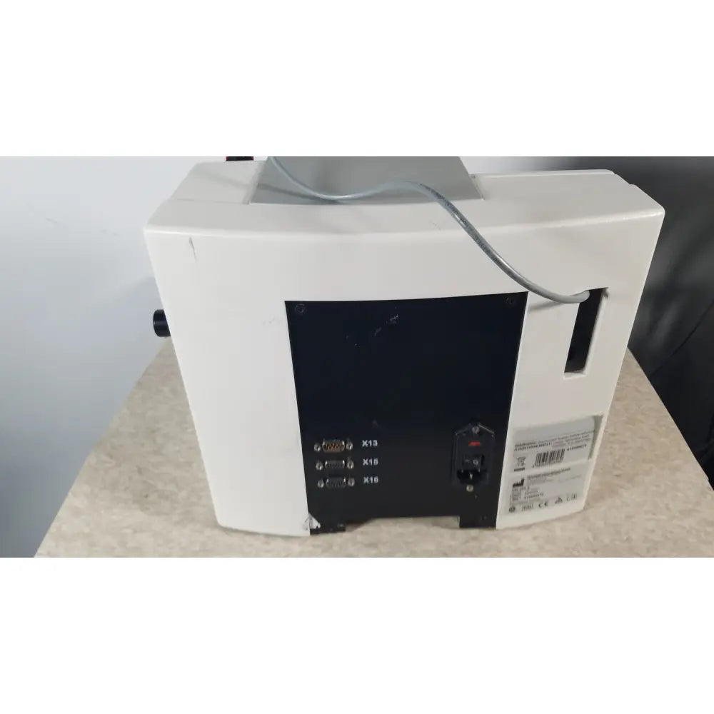 Back side of thermo scientific microm hm 355 s rotary microtome showing white medical monitor with black panel ports