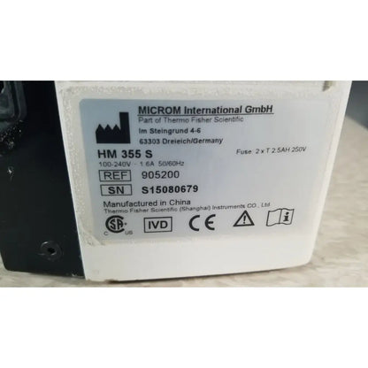 White rectangular label with black text from thermo scientific microm international gmbh on thermo scientific microm hm 355 s microtome