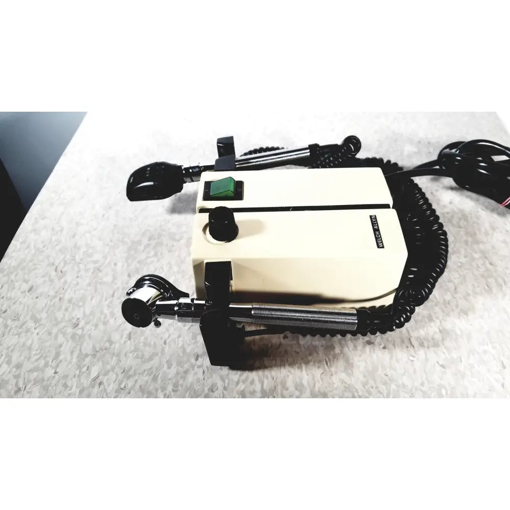 Cream-colored thermo scientific slidemate surgical microscope with black arms and green power switch for laboratory use