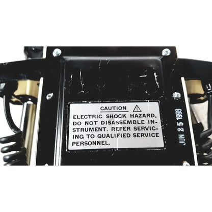 Black plastic housing with white caution label dated june 2 1983 on back of thermo scientific slidemate laboratory printer