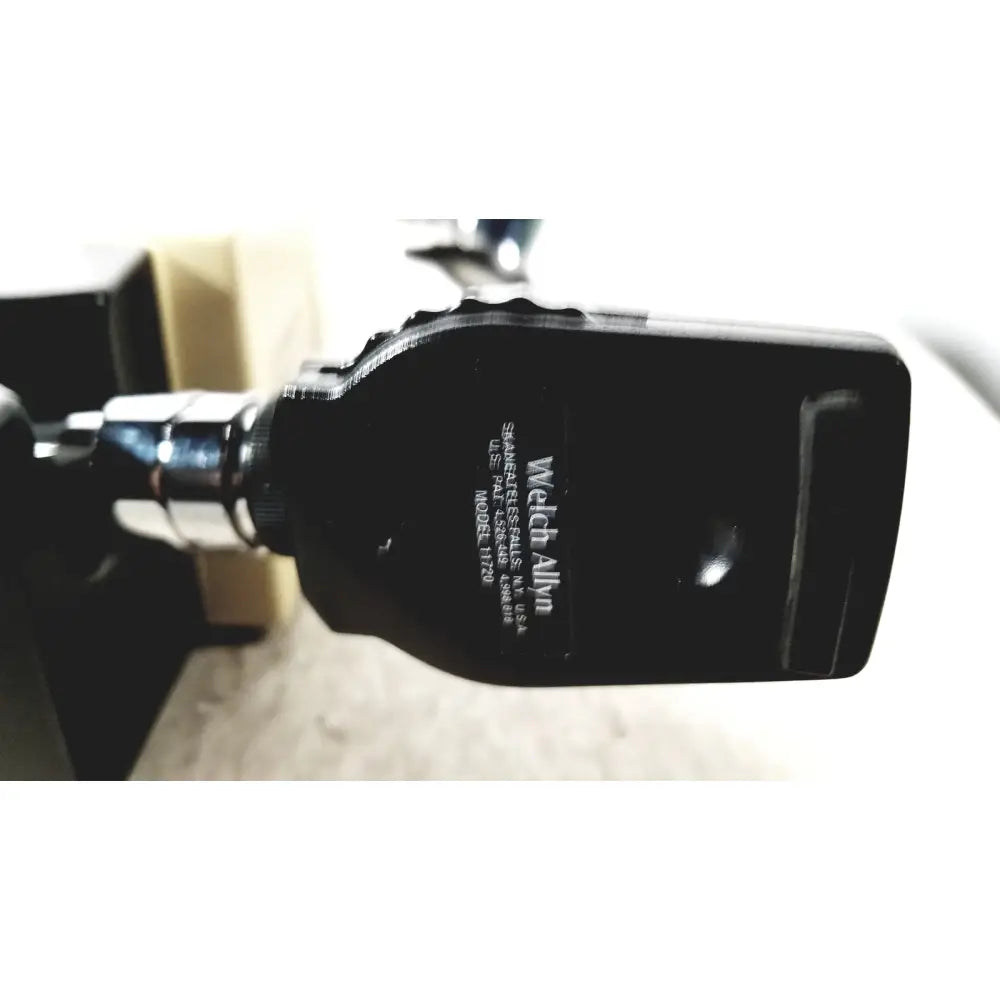 Black welch allyn 11720 patient monitor with matte finish and silver accents shown with thermo scientific slidemate printer laboratory device