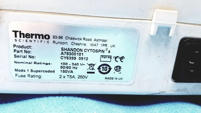 White plastic label with black text showing specifications for thermo shandon cytospin 4 centrifuge with rotor for reuse medical purposes