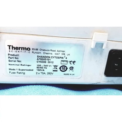 White plastic label with black text showing specifications for thermo shandon cytospin 4 centrifuge with rotor for reuse medical purposes