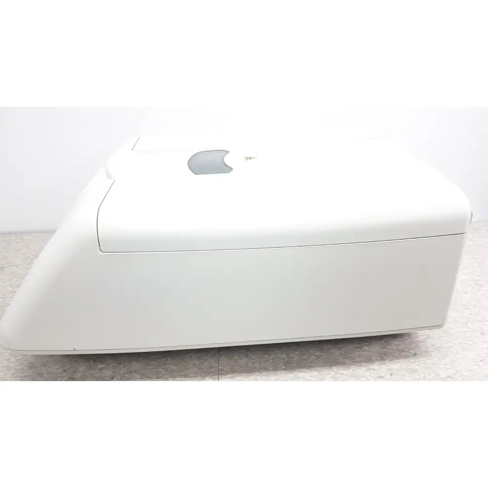 White apple imac with sleek minimalist design and glossy finish alongside thermo shandon cytospin control a78300101 centrifuge