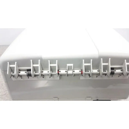 White plastic thermo shandon cytospin 4 control a78300101 centrifuge featuring red and white spring-loaded latches