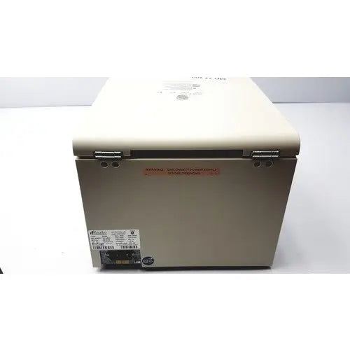 Beige thermo sorvall biofuge primo centrifuge with metal latches and warning label on the side for laboratory use