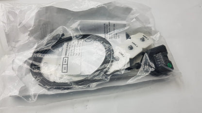Black coiled cable with white connectors and black rectangular component with green labeling for thought technology physiological data acquisition