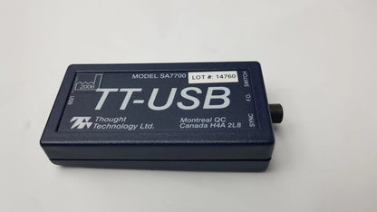 Black rectangular thought technology sa7700 usb adapter with white labeling and rotary switch for physiological data acquisition