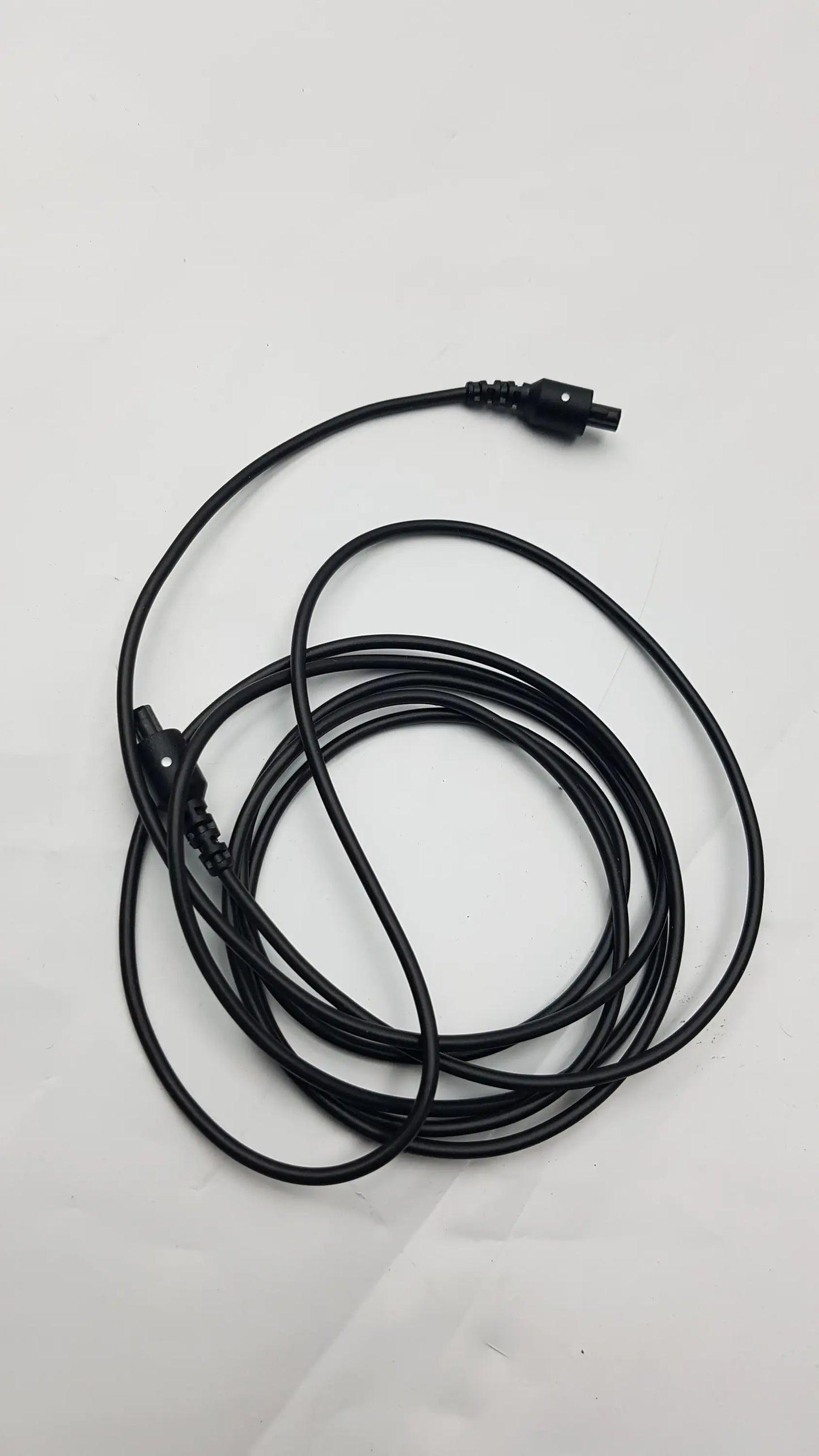 Black coiled audio cable with two identical connectors for thought technology physiological data acquisition device accessories