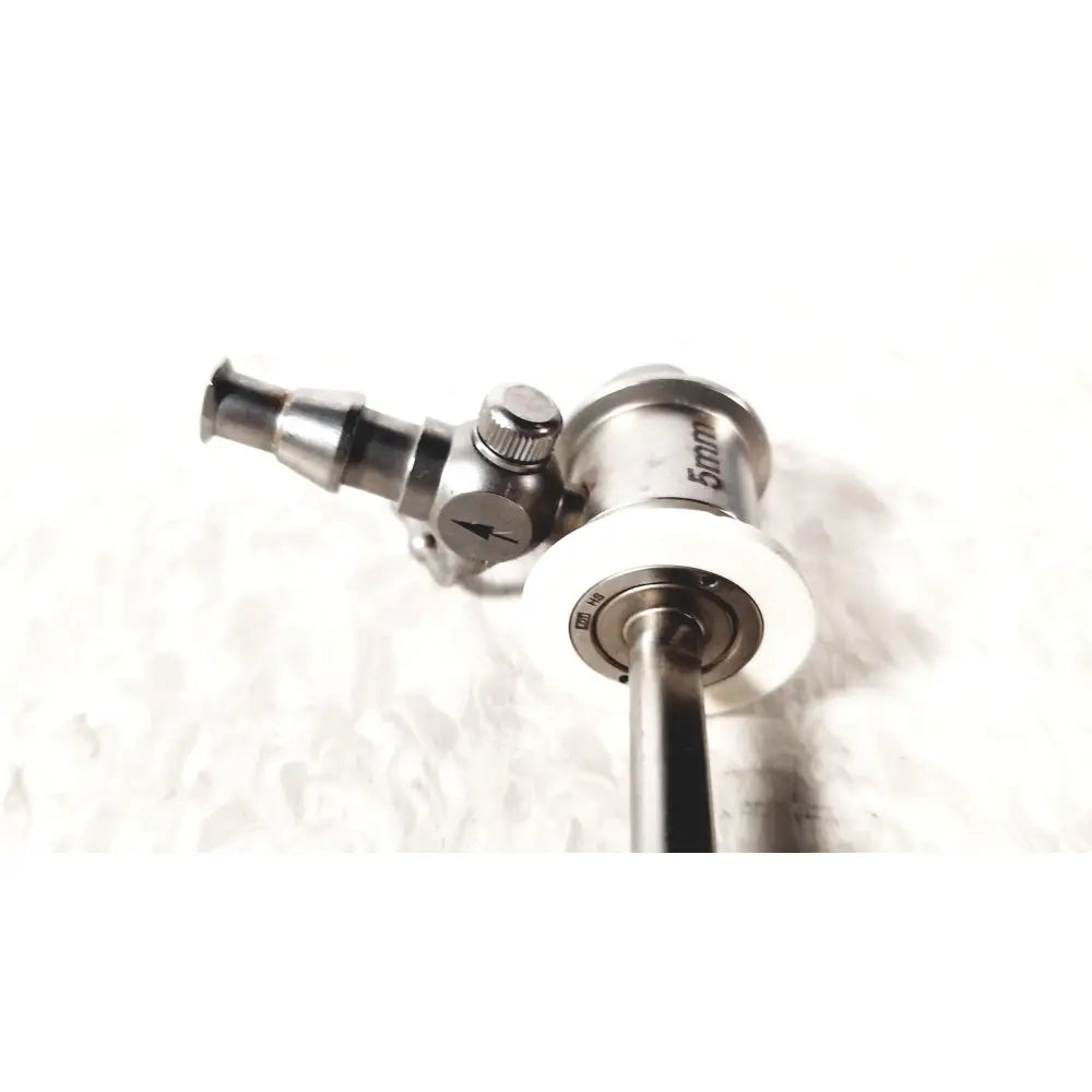 Silver metallic ths arthroscopy sheath with 5mm diameter and white circular component for surgical endoscopy use
