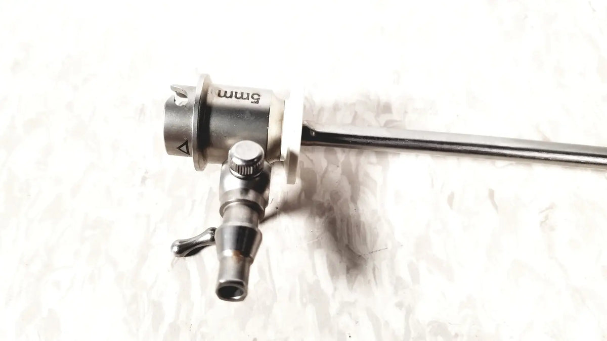 Silver-colored 5mm surgical endoscope with metallic body and articulated joints in ths arthroscopy sheath product