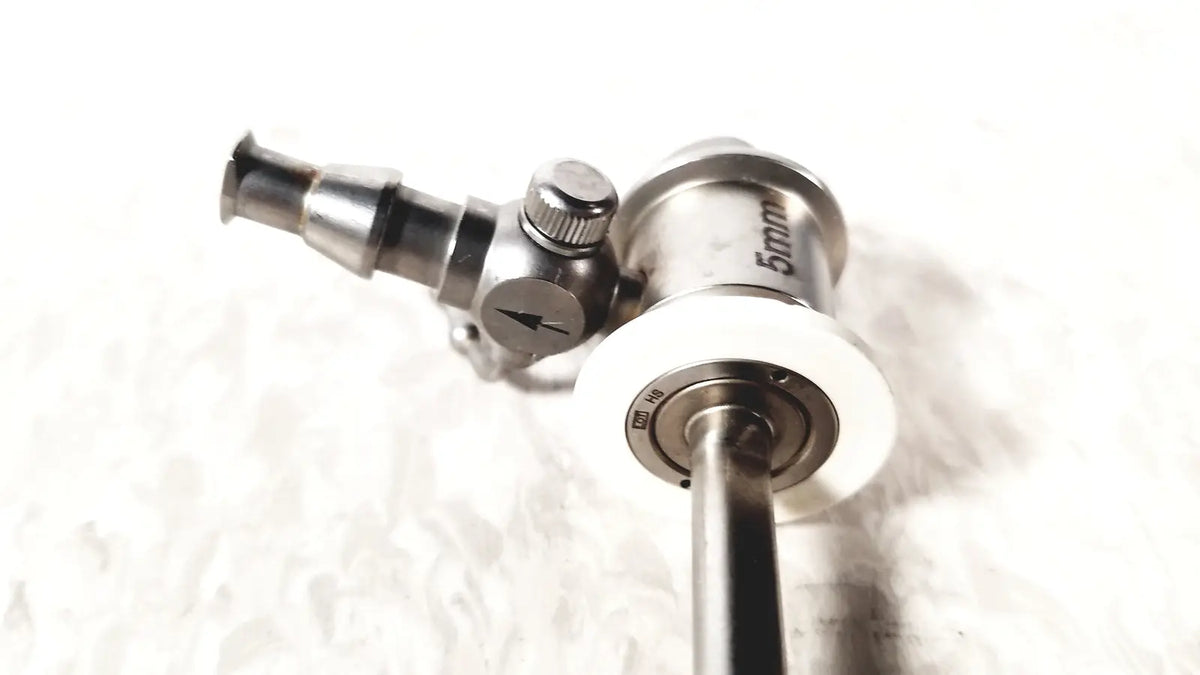 Silver metallic ths arthroscopy sheath with 5mm diameter and white circular component for surgical endoscopy use