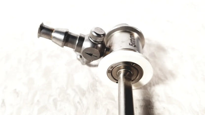 Silver metallic ths arthroscopy sheath with 5mm diameter and white circular component for surgical endoscopy use