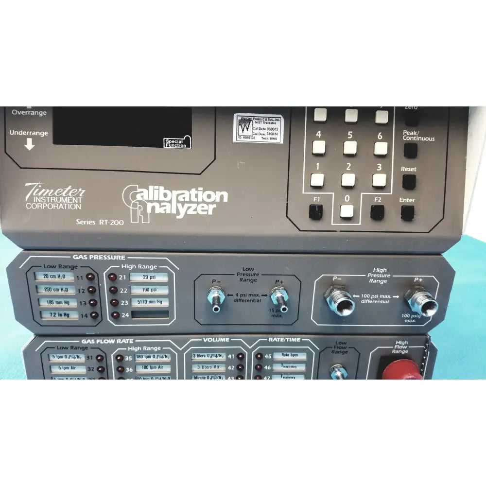 Gray metal rt 200 calibration analyzer with white labels and black buttons by timeter instrument corporation