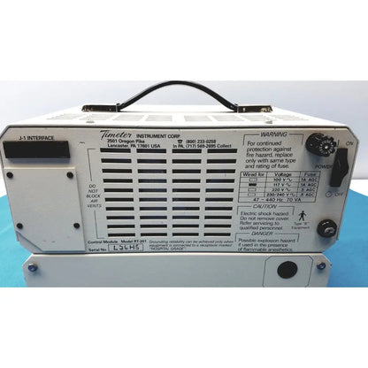 White metal industrial power supply unit with black handle and control knobs by timeter instrument corporation