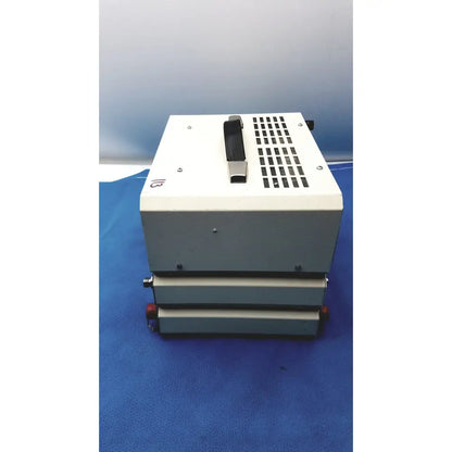 White and gray industrial-grade heat sealer with black handle and red knobs by timeter instrument corporation