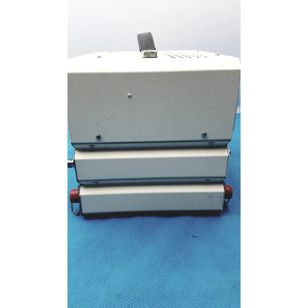 White industrial-grade heat sealer with black handle and red end caps by timeter instrument corporation for calibration use