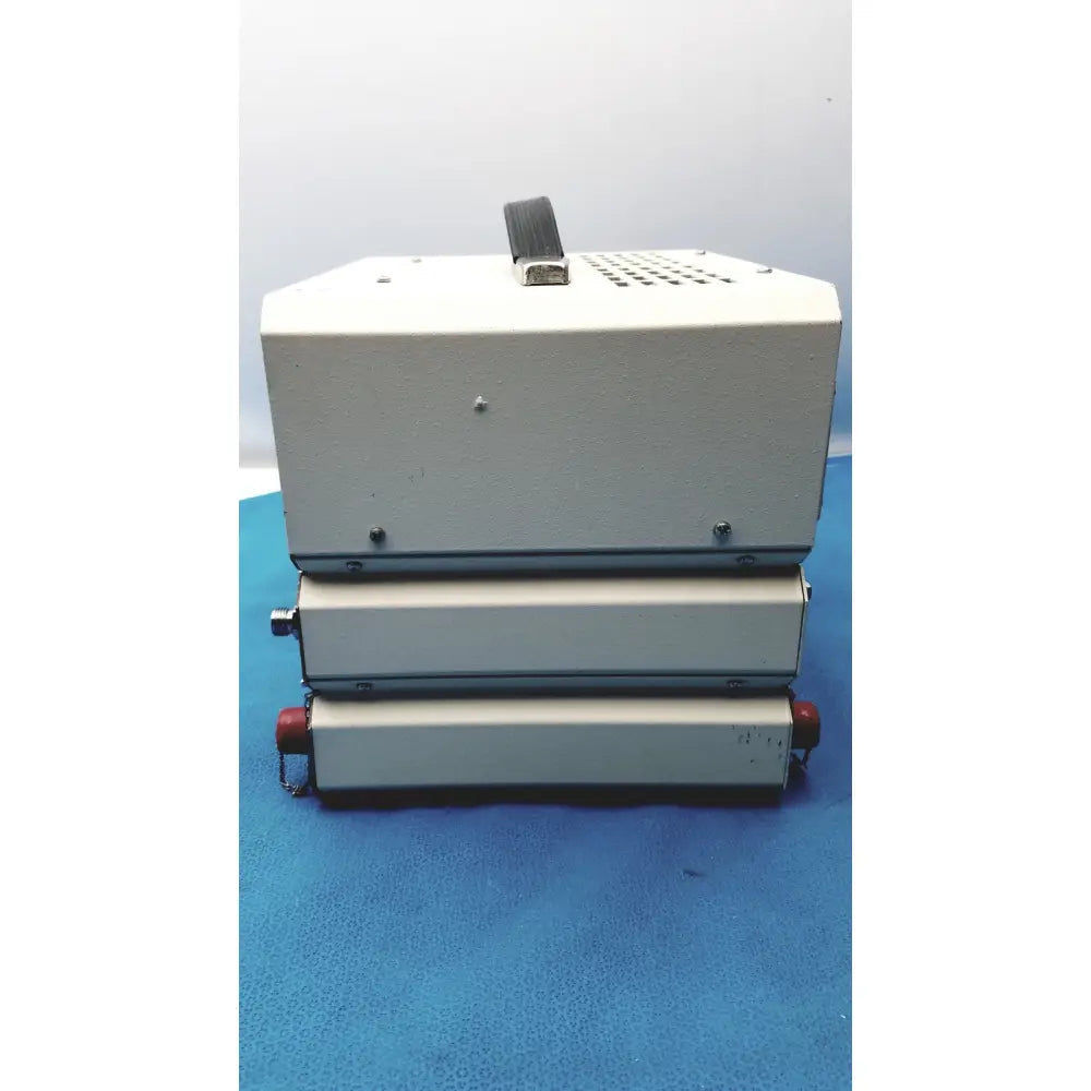 White industrial-grade heat sealer with black handle and red end caps by timeter instrument corporation rt-200 analyzer