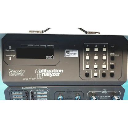 Black Timeter Instrument Corporation RT-200 calibration analyzer with digital display and keypad for precise measurements