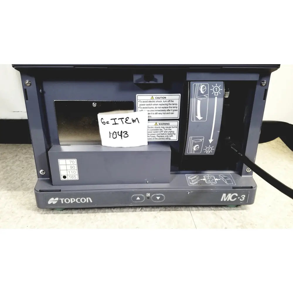 Dark gray topcon mc-3 mirror chart with metallic front panel and labeled control buttons for reuse medical tasks