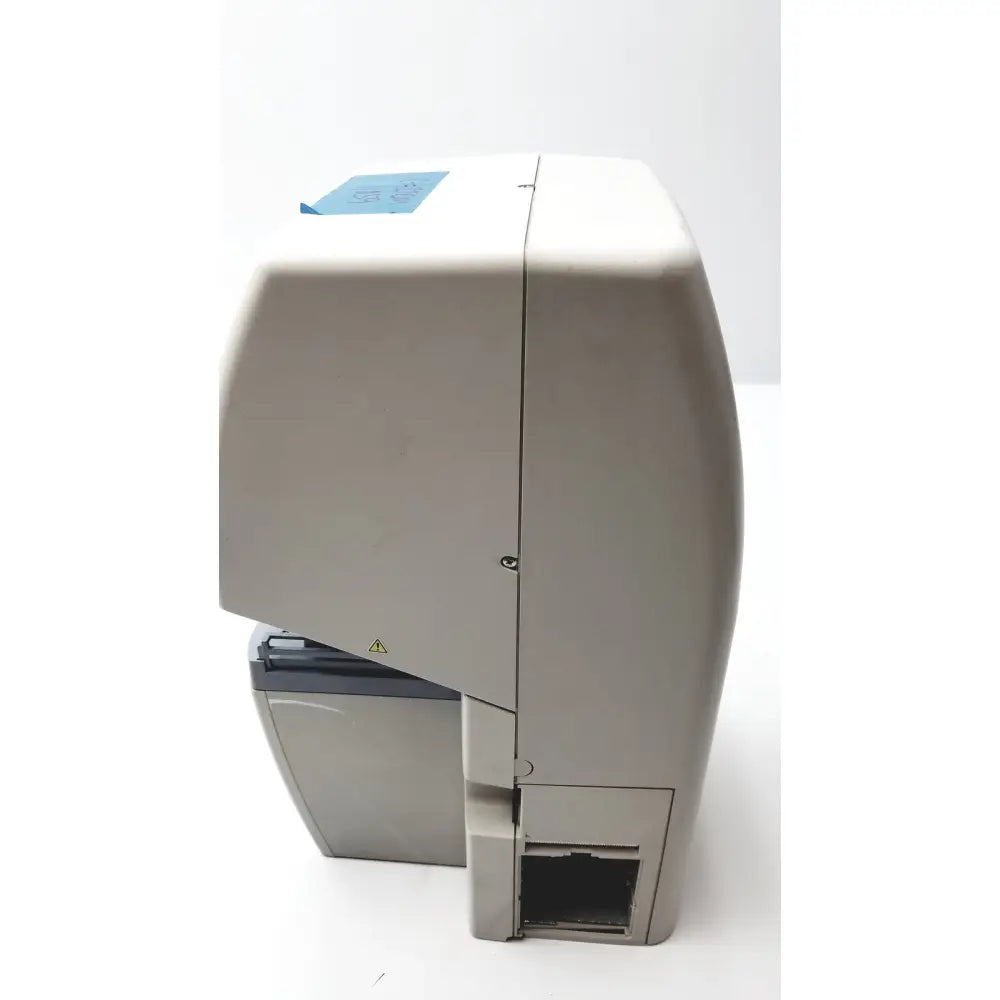 Beige plastic label printer with blue sticker and gray accents for topcon medical advance automatic lensmeter use