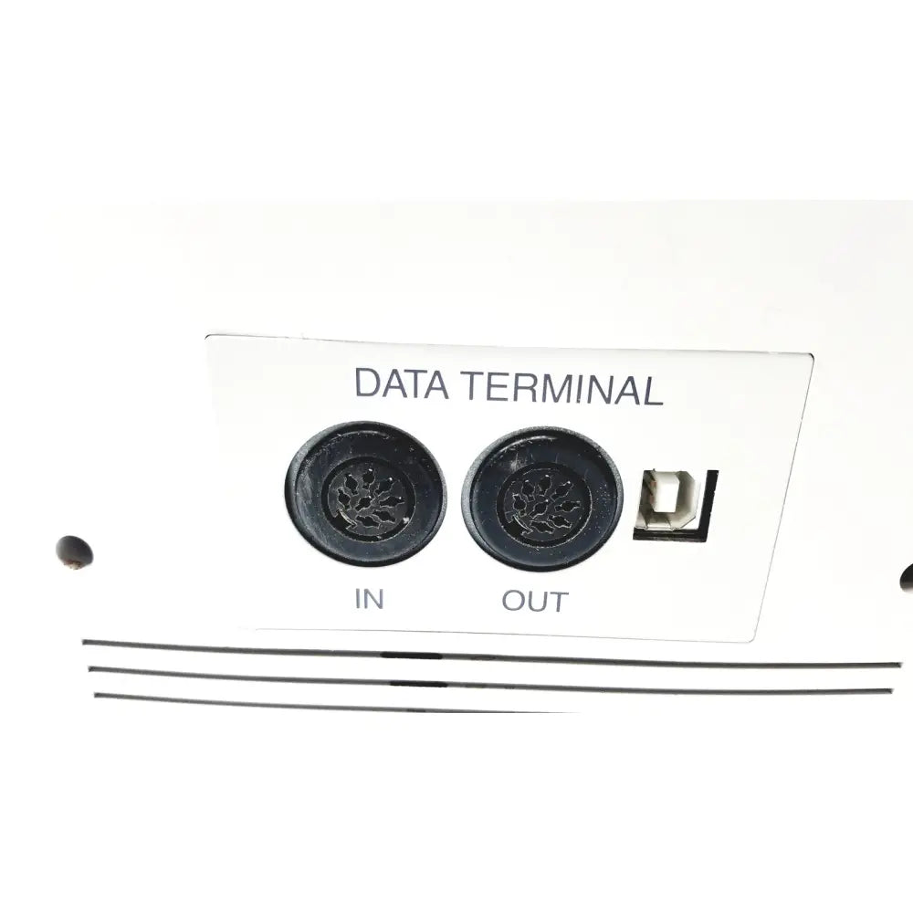 Back side of white data terminal panel with black ports and usb port on topcon medical advance automatic lensmeter