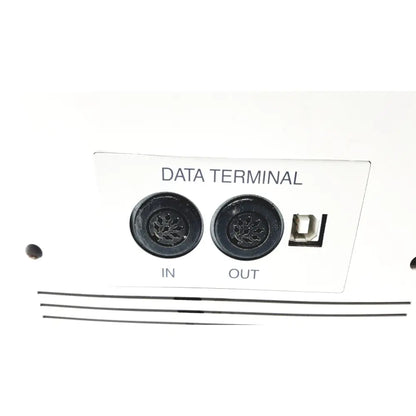 Back side of white data terminal panel with black ports and usb port on topcon medical advance automatic lensmeter